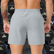 Light gray men's performance training shorts, polyester, elastic waistband.
