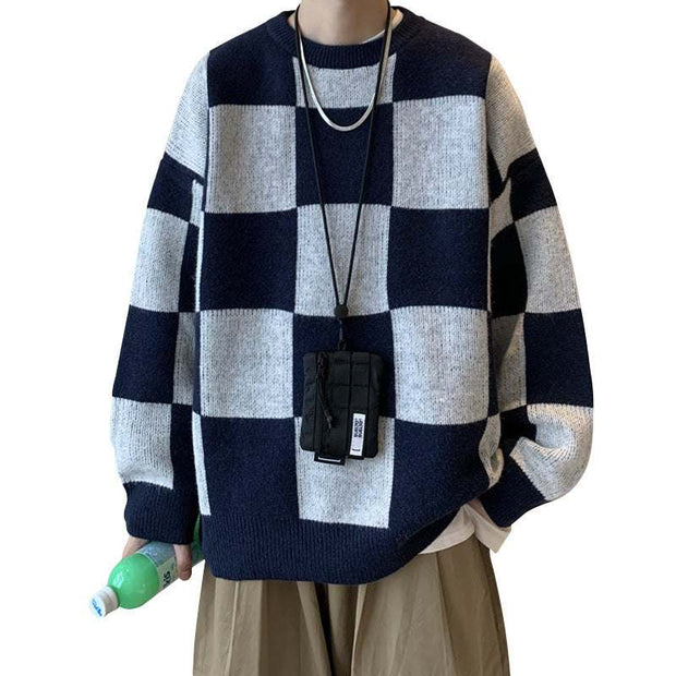 Checkered loose cotton knit pullover in navy blue and white.